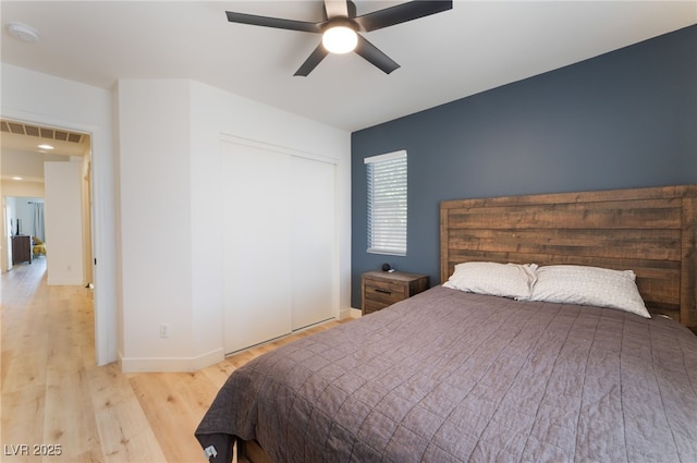 7909 Lovely Pine Pl, Las Vegas, NV 89143 - bedroom with wood finished floors, a closet, and a ceiling fan