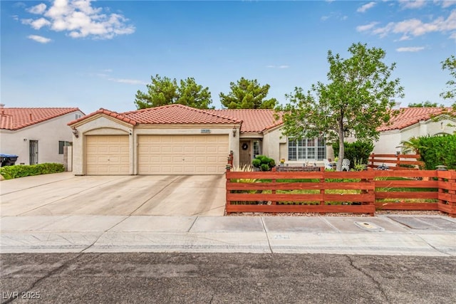 3938 Redfield Ave, North Las Vegas, NV 89032 - view of front of home with a fenced front yard, a garage, a tiled roof, stucco siding, and concrete driveway