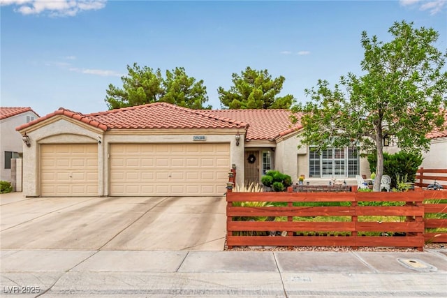 3938 Redfield Ave, North Las Vegas, NV 89032 - view of front facade with a fenced front yard, a garage, stucco siding, and concrete driveway