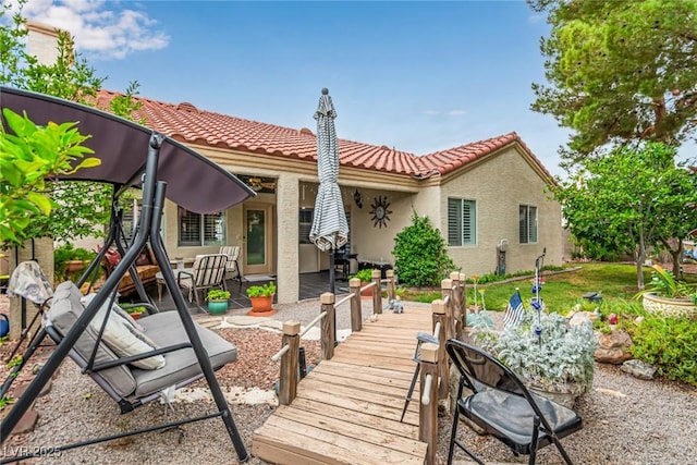 3938 Redfield Ave, North Las Vegas, NV 89032 - back of property with a tile roof, stucco siding, and a patio area