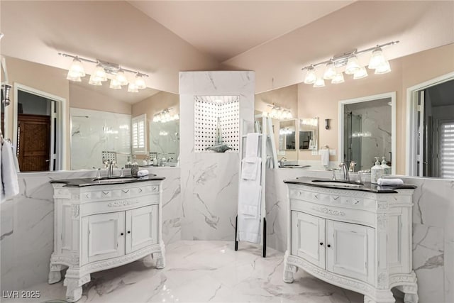 3938 Redfield Ave, North Las Vegas, NV 89032 - bathroom with a marble finish shower, two vanities, vaulted ceiling, and marble tiled floors