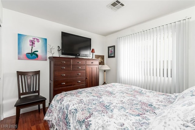 3938 Redfield Ave, North Las Vegas, NV 89032 - bedroom featuring dark wood-style flooring and baseboards
