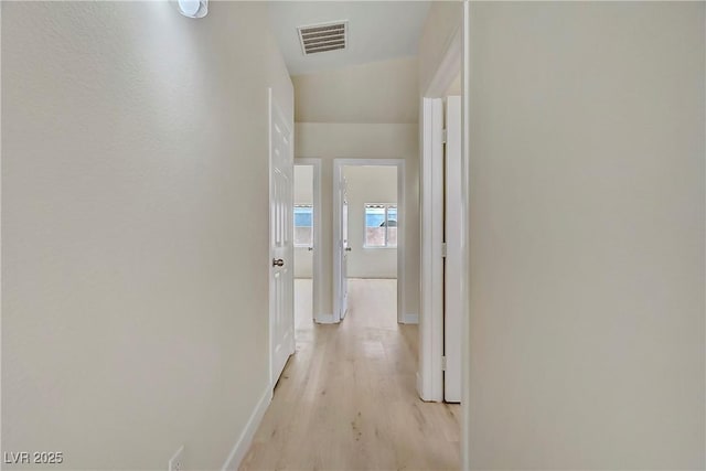 6125 Resort Ridge St, Las Vegas, NV 89130 - corridor with baseboards and light wood-type flooring