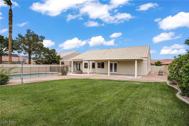 6125 Resort Ridge St, Las Vegas, NV 89130 - rear view of house featuring french doors, a fenced backyard, a patio area, and stucco siding