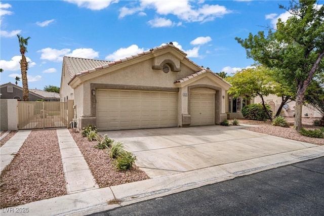 6125 Resort Ridge St, Las Vegas, NV 89130 - view of front of property featuring a garage, stucco siding, concrete driveway, and a tiled roof
