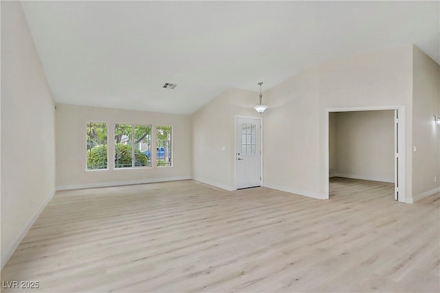 6125 Resort Ridge St, Las Vegas, NV 89130 - unfurnished living room with lofted ceiling and light wood-type flooring