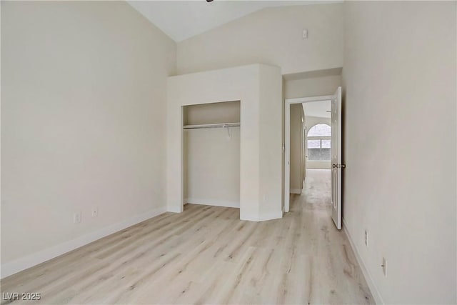 6125 Resort Ridge St, Las Vegas, NV 89130 - unfurnished bedroom with light wood-style flooring, a closet, and lofted ceiling