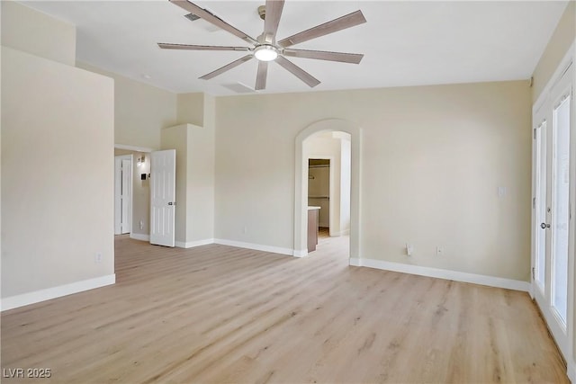 6125 Resort Ridge St, Las Vegas, NV 89130 - unfurnished room with a ceiling fan, arched walkways, and light wood-style floors