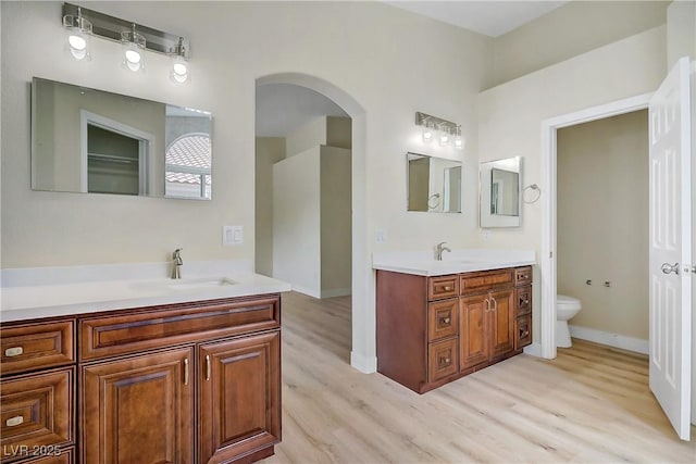 6125 Resort Ridge St, Las Vegas, NV 89130 - full bathroom with wood finished floors and vanity