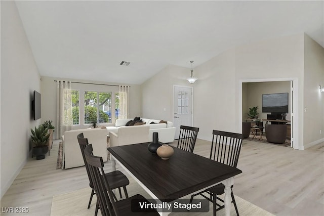 6125 Resort Ridge St, Las Vegas, NV 89130 - dining room featuring lofted ceiling and light wood-style flooring