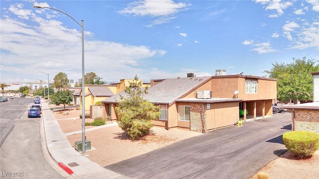 1500 Hialeah Dr Unit C, Las Vegas, NV 89119 - view of property with stucco siding and a tiled roof