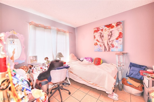1500 Hialeah Dr Unit C, Las Vegas, NV 89119 - bedroom featuring a textured ceiling and light tile patterned floors