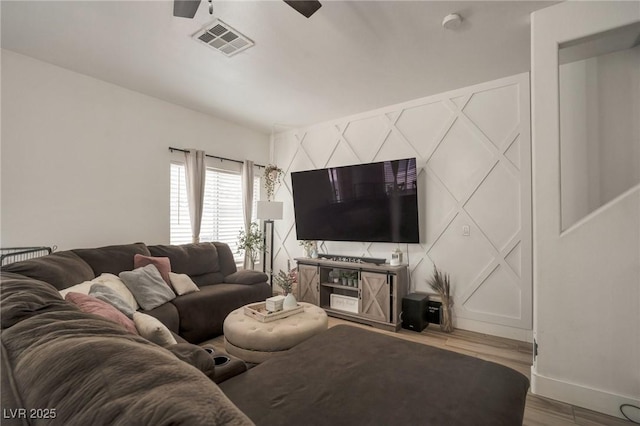 6388 Extreme Shear Ave Unit 103, Henderson, NV 89011 - living area with wood finished floors and ceiling fan