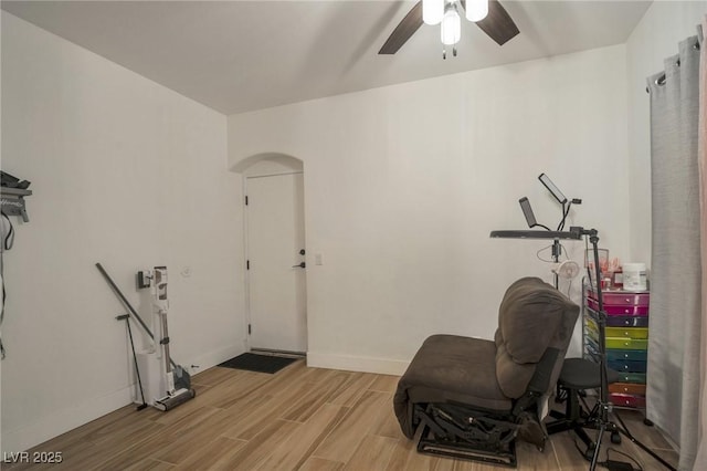 6388 Extreme Shear Ave Unit 103, Henderson, NV 89011 - exercise area featuring light wood-type flooring, ceiling fan, and arched walkways