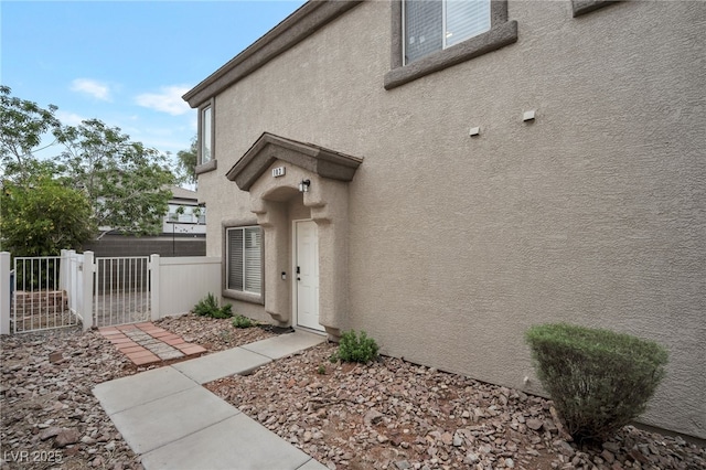 6388 Extreme Shear Ave Unit 103, Henderson, NV 89011 - view of exterior entry featuring stucco siding and a gate