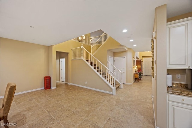 1084 Via Della Costrella, Henderson, NV 89011 - unfurnished living room with stairs, a chandelier, and recessed lighting