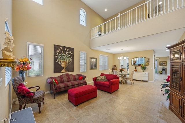 1084 Via Della Costrella, Henderson, NV 89011 - living area with a towering ceiling, a chandelier, light tile patterned floors, and recessed lighting