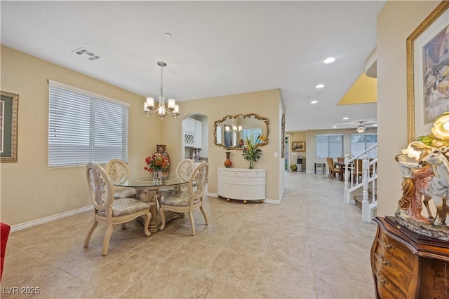 1084 Via Della Costrella, Henderson, NV 89011 - dining space featuring a chandelier, recessed lighting, light tile patterned floors, arched walkways, and a ceiling fan