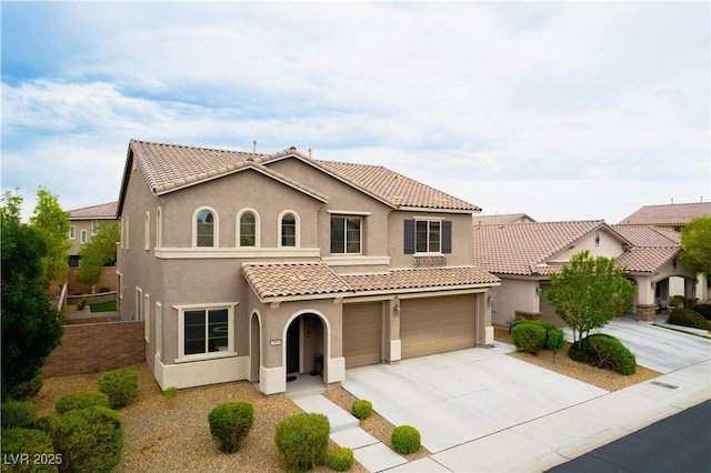 1084 Via Della Costrella, Henderson, NV 89011 - mediterranean / spanish home with stucco siding, a garage, concrete driveway, and a tile roof