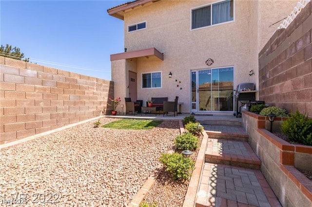 3393 Narod St, Las Vegas, NV 89121 - back of house with stucco siding and a patio area