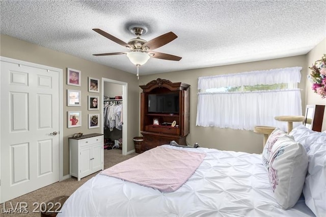 3393 Narod St, Las Vegas, NV 89121 - bedroom with carpet flooring, a walk in closet, a textured ceiling, ceiling fan, and a closet