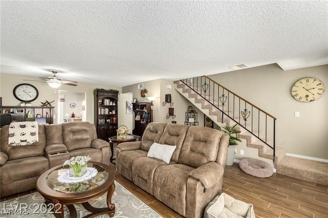 3393 Narod St, Las Vegas, NV 89121 - living room with stairs, a textured ceiling, wood finished floors, and ceiling fan