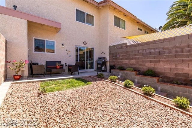 3393 Narod St, Las Vegas, NV 89121 - rear view of property featuring stucco siding and a patio