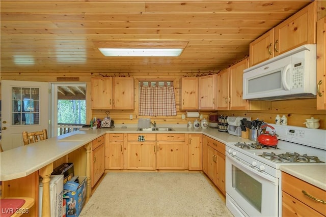 1458 W 6400 S, Cedar City, UT 84720 - kitchen with white appliances, light brown cabinetry, wooden ceiling, a peninsula, and light countertops