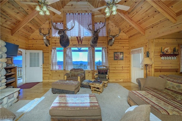 1458 W 6400 S, Cedar City, UT 84720 - living area with ceiling fan, a wooden ceiling with exposed beams, wood walls, healthy amount of natural light, and high vaulted ceiling