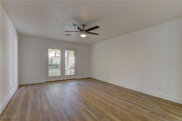 7629 Oyster Cove Dr, Las Vegas, NV 89128 - empty room featuring a ceiling fan, light wood-type flooring, and french doors