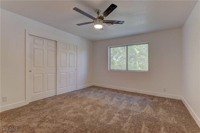7629 Oyster Cove Dr, Las Vegas, NV 89128 - unfurnished bedroom with carpet, a closet, and ceiling fan