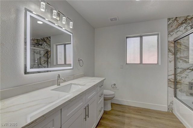 7629 Oyster Cove Dr, Las Vegas, NV 89128 - full bath with vanity, wood finished floors, and enclosed tub / shower combo