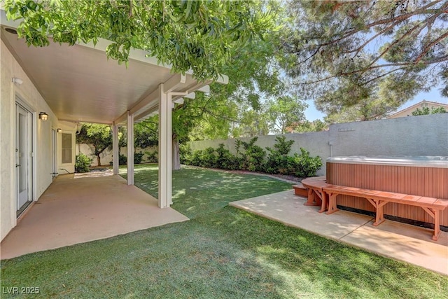 7629 Oyster Cove Dr, Las Vegas, NV 89128 - fenced backyard featuring a hot tub and a patio area