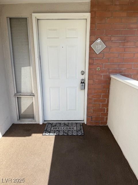 793 Oakmont Ave Unit 202, Las Vegas, NV 89109 - doorway to property featuring brick siding
