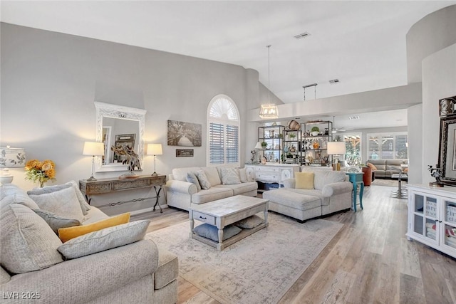 9553 Gainey Ranch Ave, Las Vegas, NV 89147 - living area with high vaulted ceiling and wood finished floors