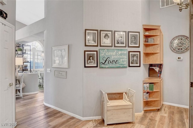 9553 Gainey Ranch Ave, Las Vegas, NV 89147 - sitting room with wood finished floors and a high ceiling