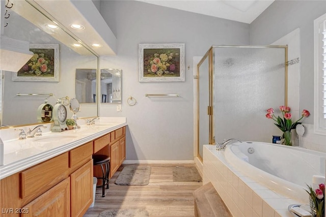9553 Gainey Ranch Ave, Las Vegas, NV 89147 - full bath featuring a shower stall, a garden tub, double vanity, wood finished floors, and recessed lighting