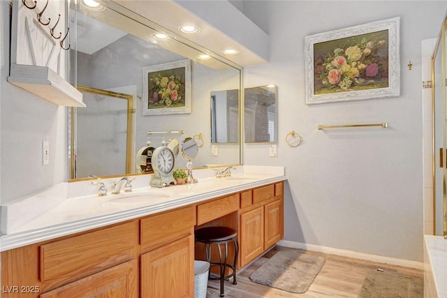 9553 Gainey Ranch Ave, Las Vegas, NV 89147 - full bathroom with a stall shower, double vanity, wood finished floors, and recessed lighting