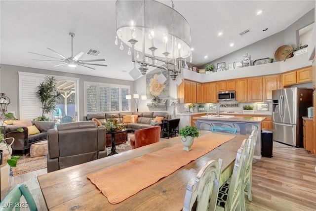 9553 Gainey Ranch Ave, Las Vegas, NV 89147 - dining space featuring light wood-style flooring, ceiling fan, recessed lighting, and high vaulted ceiling