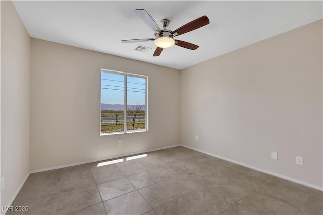 1770 W Charleston Park Ave, Pahrump, NV 89048 - spare room featuring a ceiling fan, light tile patterned floors, and a mountain view