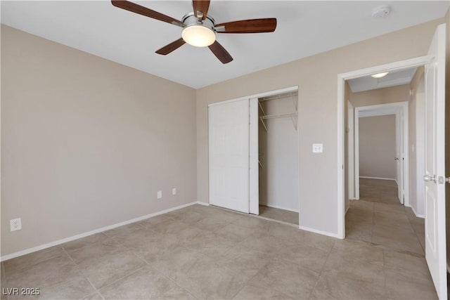1770 W Charleston Park Ave, Pahrump, NV 89048 - unfurnished bedroom featuring a closet, a ceiling fan, and light tile patterned flooring