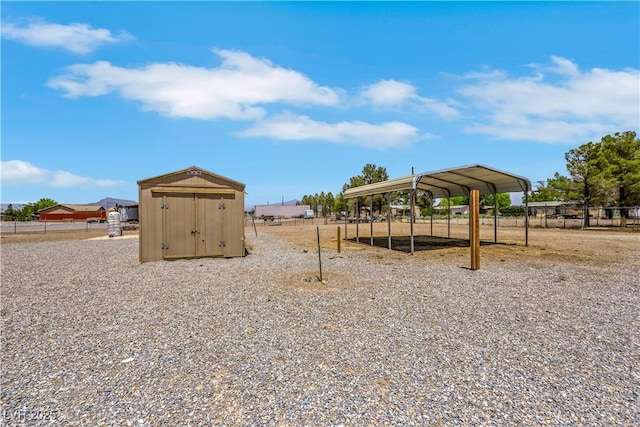 1770 W Charleston Park Ave, Pahrump, NV 89048 - view of yard with a storage shed and a detached carport