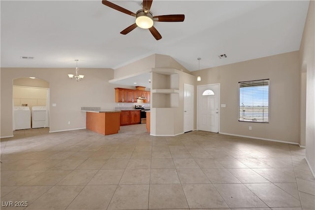 1770 W Charleston Park Ave, Pahrump, NV 89048 - unfurnished living room with washer and dryer, a chandelier, lofted ceiling, light tile patterned flooring, and ceiling fan