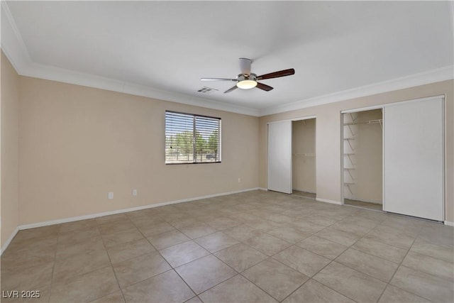 1770 W Charleston Park Ave, Pahrump, NV 89048 - unfurnished bedroom with multiple closets, crown molding, and a ceiling fan