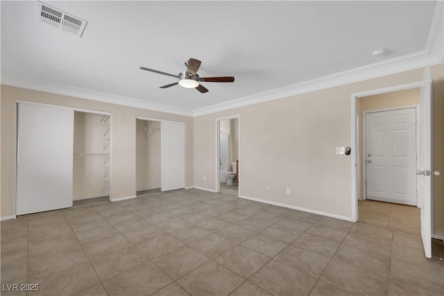 1770 W Charleston Park Ave, Pahrump, NV 89048 - unfurnished bedroom with crown molding, multiple closets, ceiling fan, and ensuite bathroom