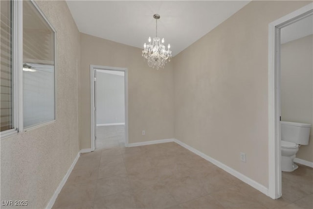 1770 W Charleston Park Ave, Pahrump, NV 89048 - unfurnished dining area with a chandelier, light tile patterned floors, and a ceiling fan