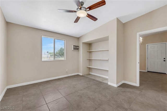 1770 W Charleston Park Ave, Pahrump, NV 89048 - spare room with built in shelves, ceiling fan, a wall mounted AC, lofted ceiling, and tile patterned flooring