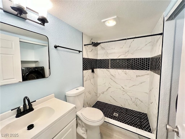 601 Cabrillo Cir Unit 1293, Henderson, NV 89015 - full bathroom with washer / dryer, a textured ceiling, a marble finish shower, vanity, and a textured wall