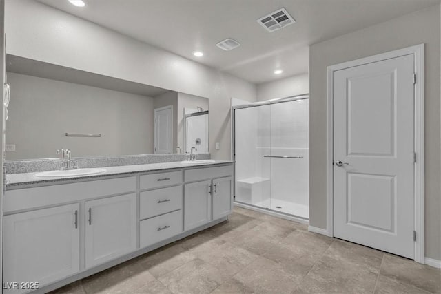 487 Via Renata, Henderson, NV 89044 - full bathroom with a shower stall, double vanity, and recessed lighting