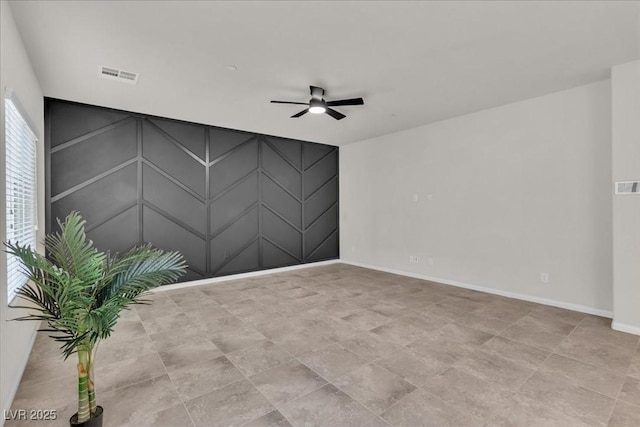 487 Via Renata, Henderson, NV 89044 - unfurnished room with ceiling fan and a decorative wall